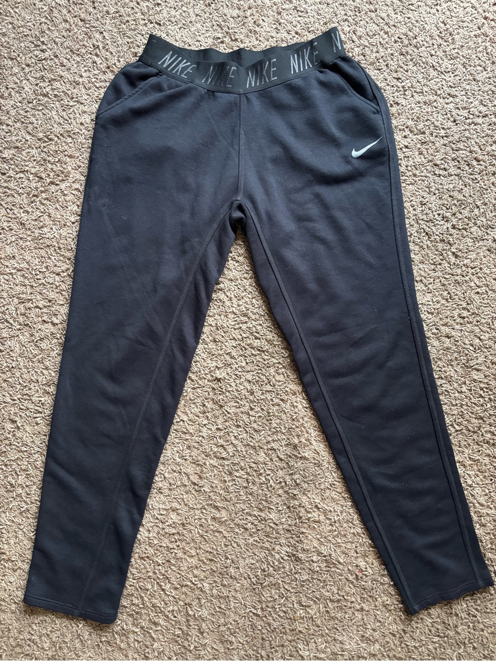 Nike Black Jogger-Style Track Pants with White Swoosh